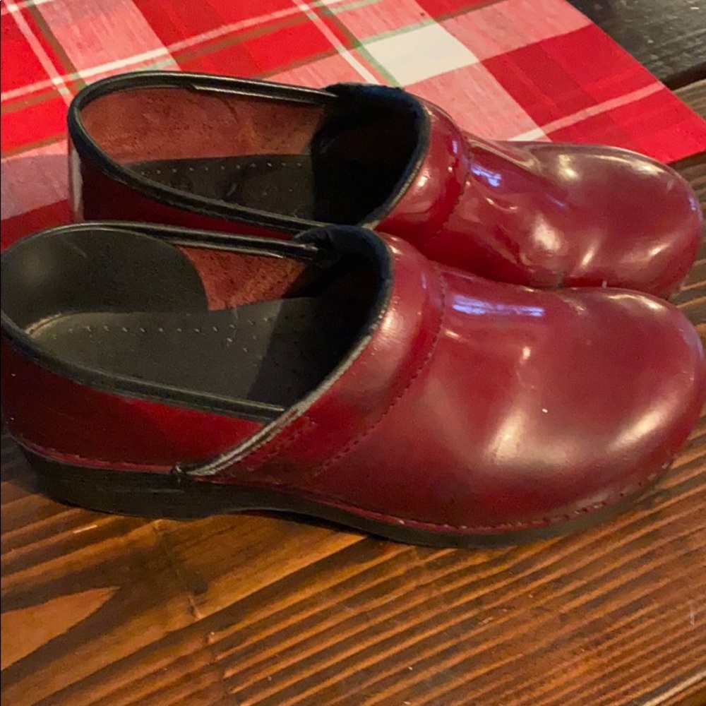 Dansko patent leather clogs